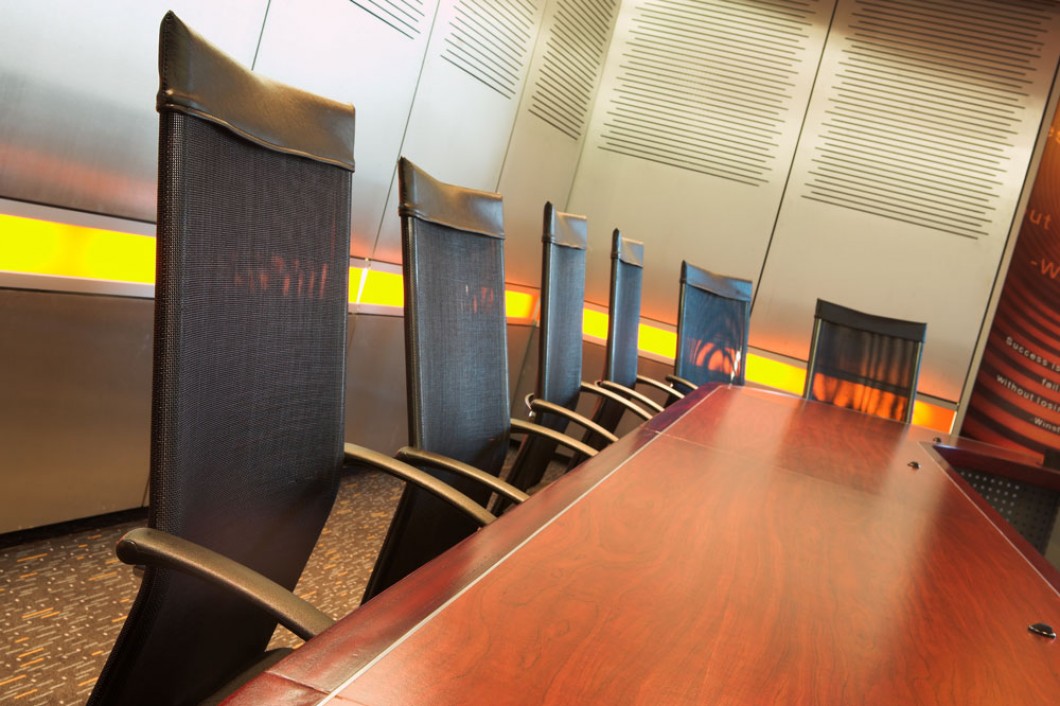 six office chairs around a conference table